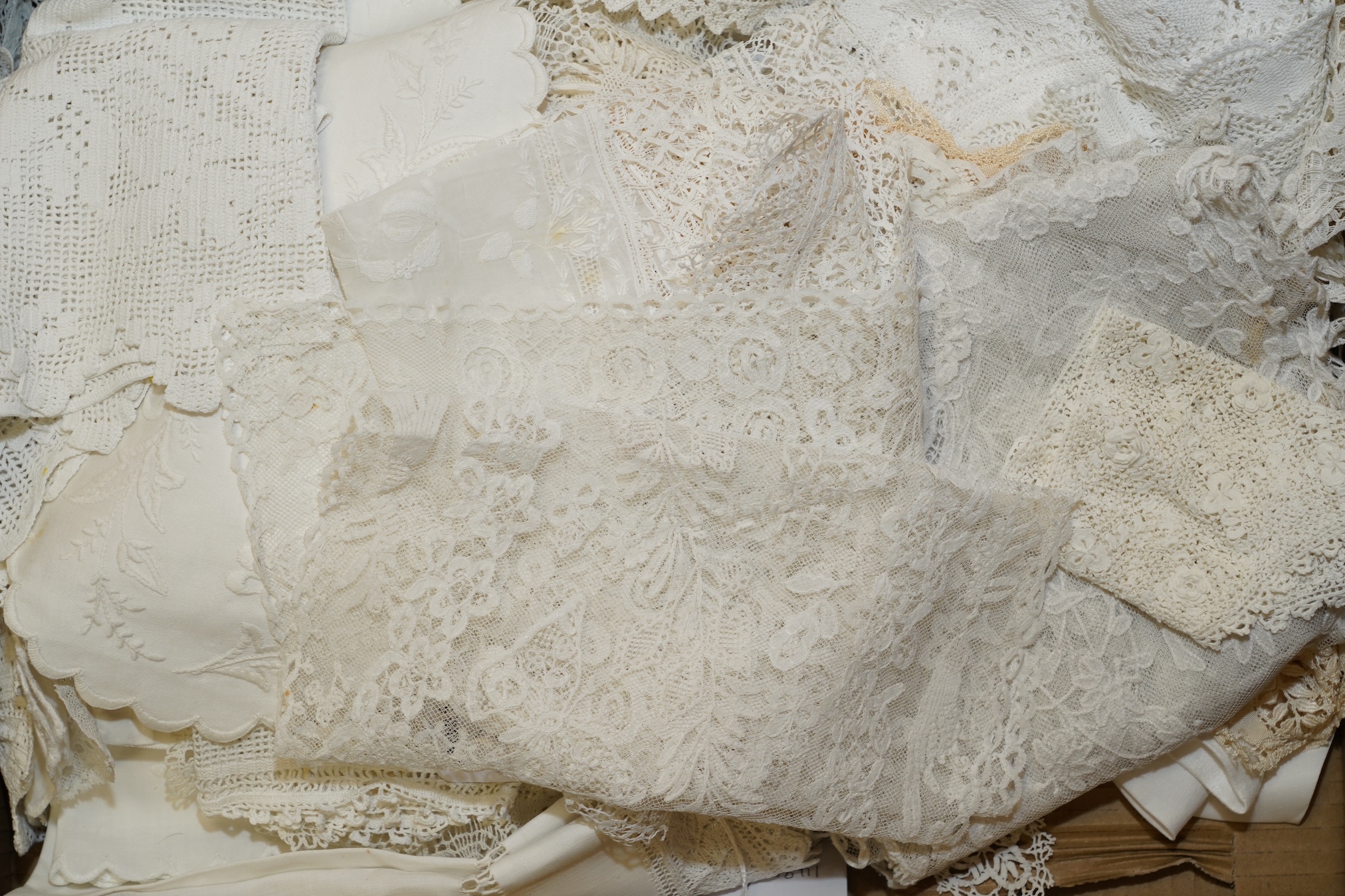 An early 20th century christening gown, a later crocheted cover, various bobbin lace collars, silk Maltese, Honiton, Irish crochet, etc., and a machine lace stole, crochet mats. Condition - all in good condition, launder